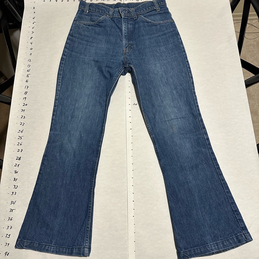 Vintage Levis rare big E hi waist bell bottom jeans. Fits 27-28.